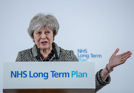 Theresa May speaking at an NHS conference