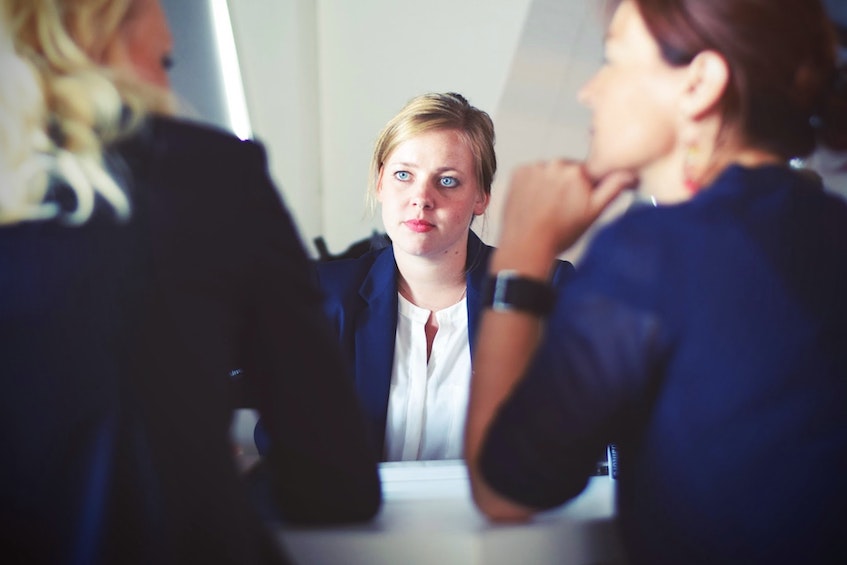 Woman manager looking anxious in metting