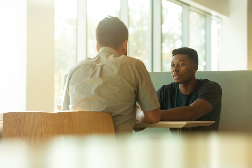 Tense meeting in a workplace canteen