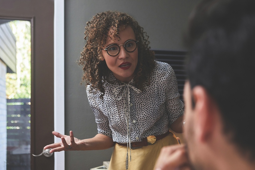 Heated conversation between man and woman in an office