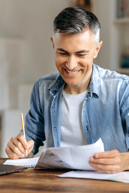 Man working at home at the kitchen table