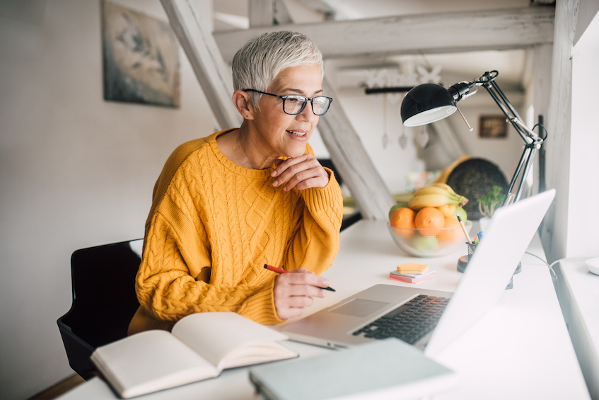 Woman working in a loft space at home