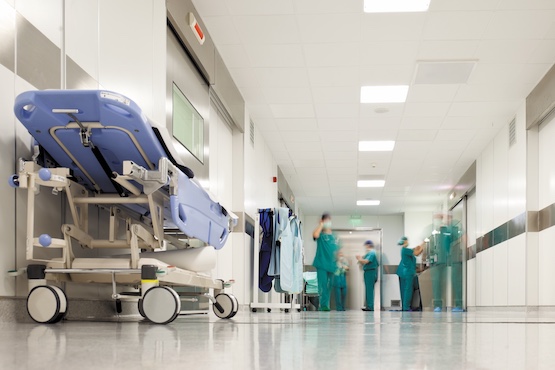 trolley in busy hospital corridor